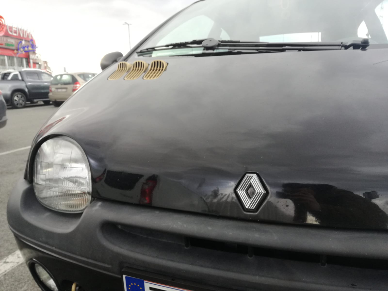 The badge is the old-school 80s Renault logo. I glued the pins from the new badge over to this one and popped it in. It’ll become gold, too, once I figure out a reliable way to paint the inner stripes back to black after the gold.